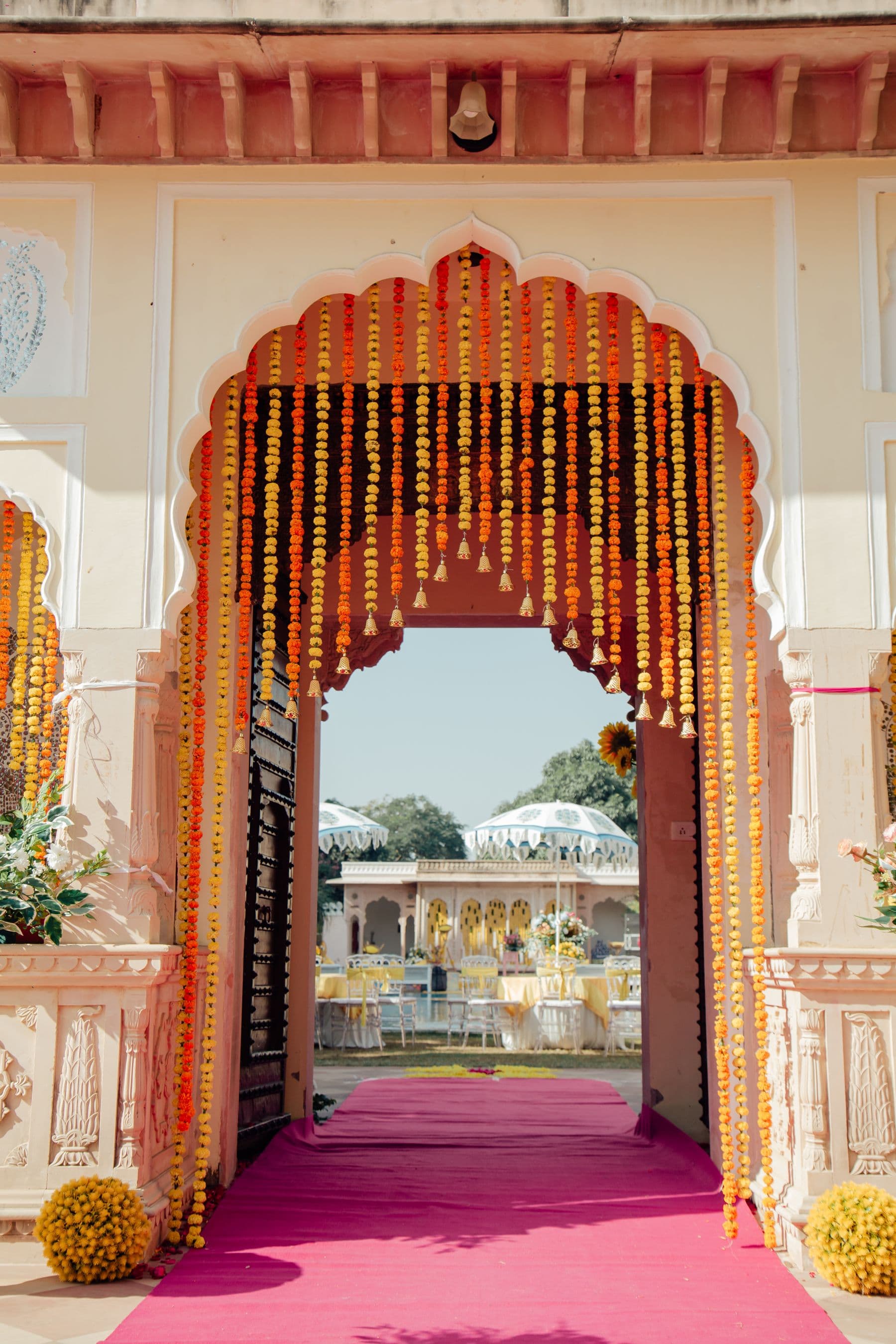Entrance gate decorated with marigold garlands at night